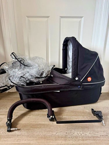 Out about double carrycot - out, n
